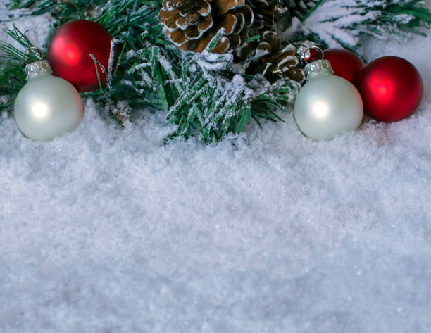 istock Pine Cones and Christmas Baubles in the Snow 1183449856