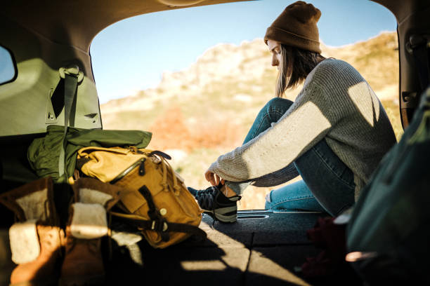 Young female hiker getting ready for adventure