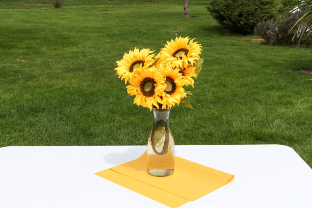 istock Sunflowers bouquet on table in the garden 1183453249