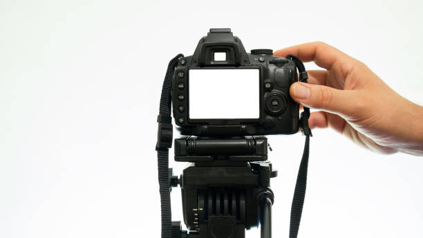 istock Hand taking pictures with a DSLR camera. mockup camera view 1183469651