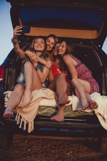 istock Four girlfriends taking a selfie together on their camping adventure 1183472272
