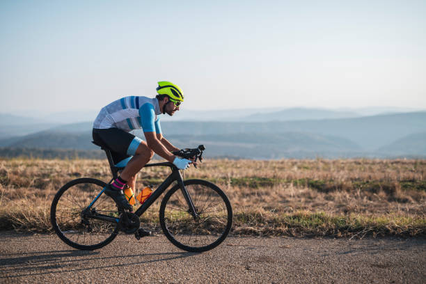 istock Man cycling outdoors 1183473327