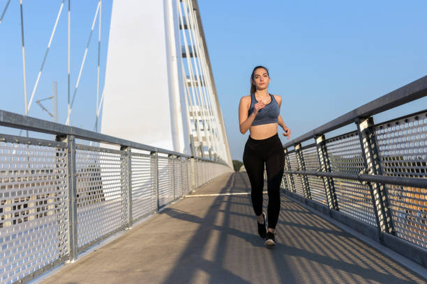 istock Beautiful woman jogging 1183473880