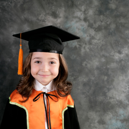 little girl in graduation out-fit.
