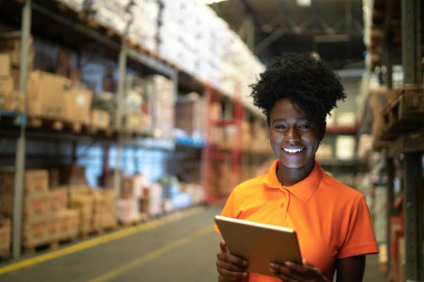 istock Portrait of young worker using digital tablet at warehouse 1183478465
