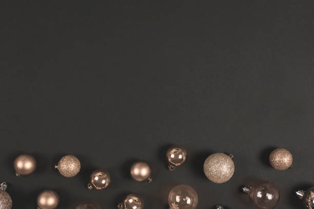 istock Golden christmas balls on a black background with space for text. Top view. Flat lay 1183478491