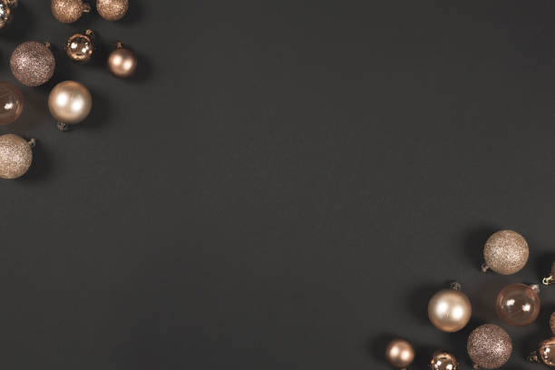 istock Golden christmas balls on a black background with space for text. Top view. Flat lay 1183478492