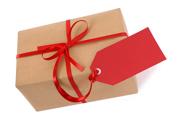 istock Brown paper package with red ribbon and tag 118348408