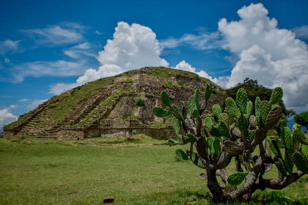 istock Pyramid with cactus and a blue sky and full of clouds 1183484538