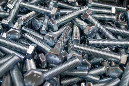 Large number of metal, steel bolts. Macro. Close-up. Background and texture.