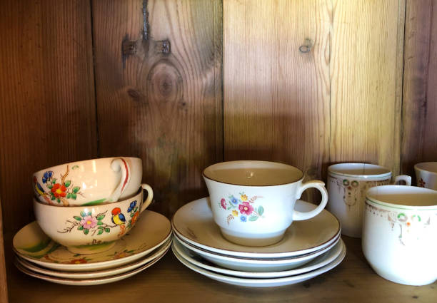 istock Pretty Vintage Coffee Cups on Rustic Wood Shelf 1183489035