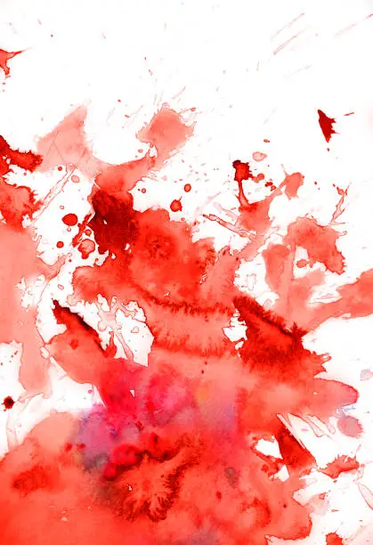 Red watercolor splatter with splashes on white watercolor paper