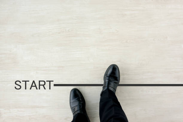 istock Business man standing on start line 1183496362
