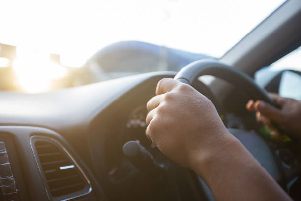 istock Businessman driving car on the road. 1183498231