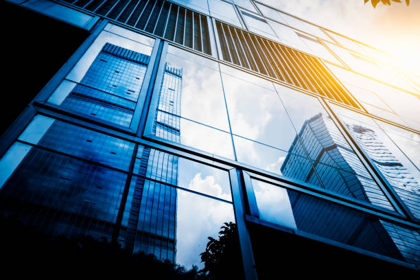 istock Modern office building against blue sky 1183500377