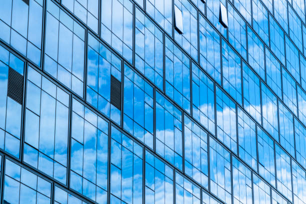 istock Clouds Reflected in Windows of Modern Office Building 1183500396