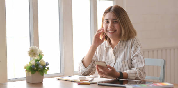 istock Professional young female designer working on her project with digital tablet 1183502306
