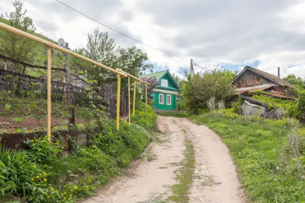 Village house, road in summer, Russia