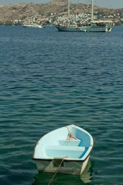 istock A small white boat on the water 1183506392