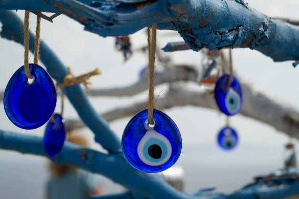 istock Stone in the form of a blue eye on the tree. 1183506492