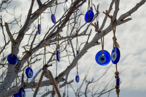 istock Stone in the form of a blue eye on the tree. 1183506517