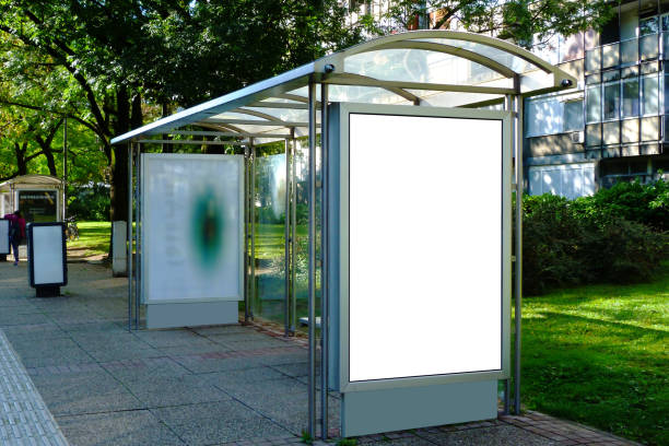 image collage of bus shelter at a bus stop of glass and aluminum frame stock photo