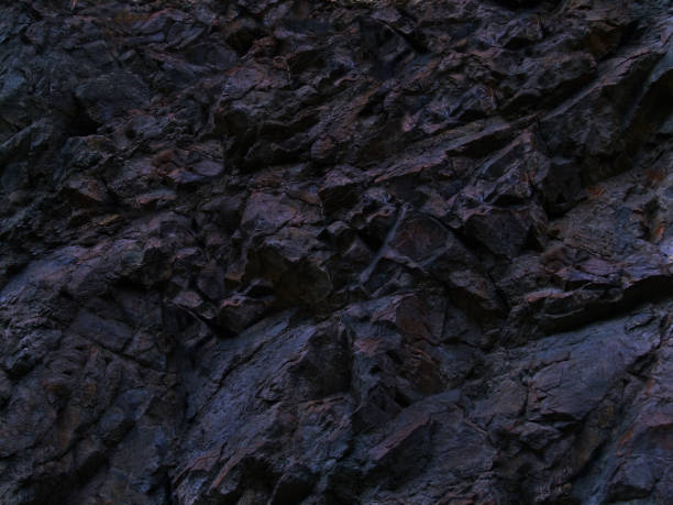 istock Black rock texture. Dark blue stone grunge background. Mountain close-up. Abstract blue stone background. 1183510088