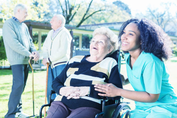 istock Nurse making elderly people smiling in the garden 1183510256