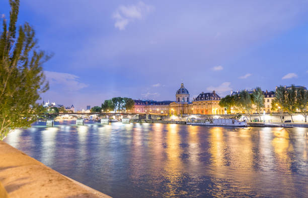 istock Paris at night along Seine river 1183513858