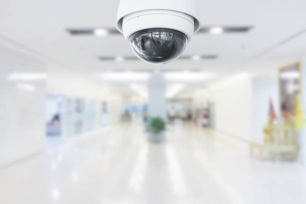 istock CCTV Security Camera operating in hospital on blur background. 1183515316