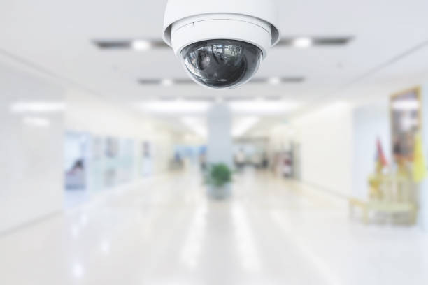 CCTV Security Camera operating in hospital on blur background. stock photo