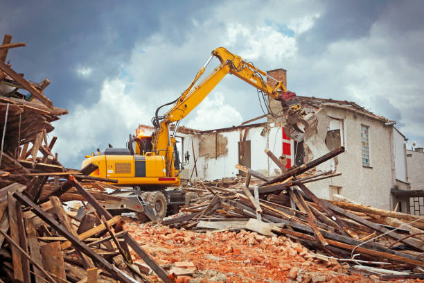 istock Bulldozers destroying old house 1183518829