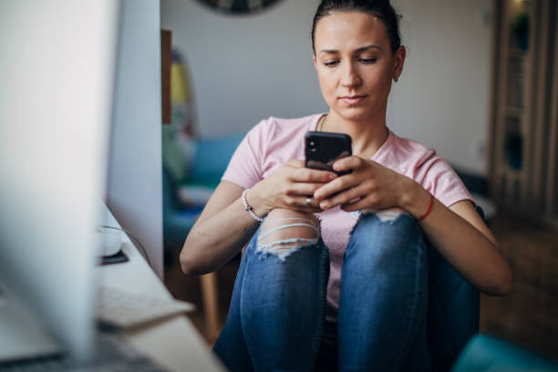 istock Woman texting on phone 1183523084