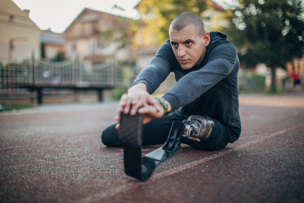 istock Man with prosthetic leg stretching 1183526847