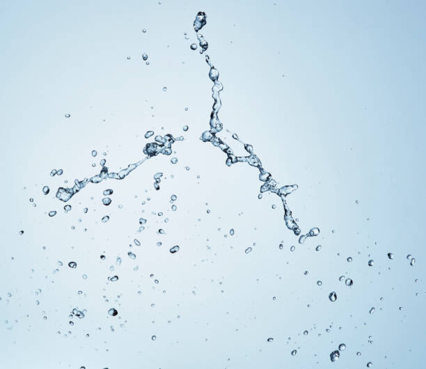 istock Splashing water with blue background 1183526902