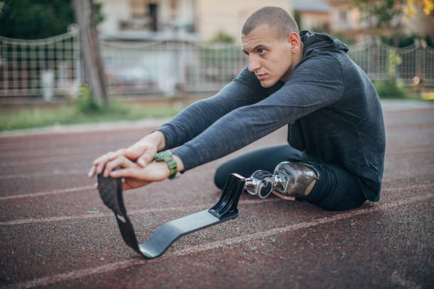 istock Man with prosthetic leg stretching 1183526929