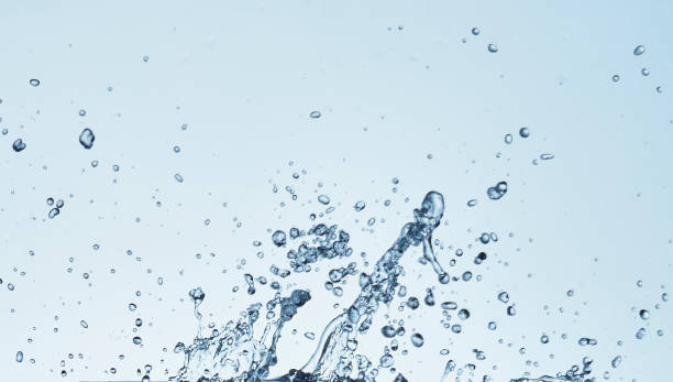 istock Splashing water with blue background 1183527158