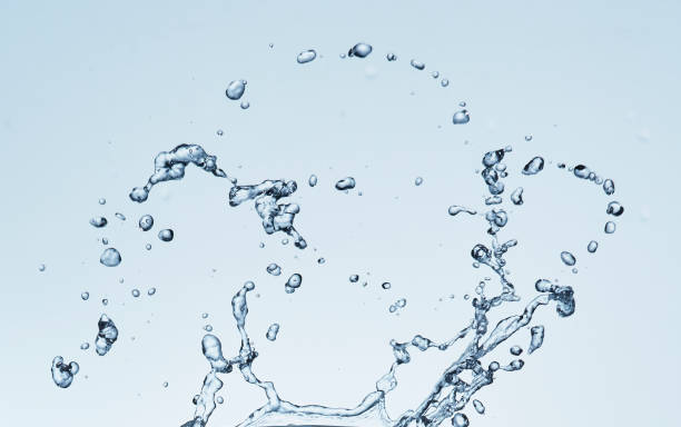 istock Splashing water with blue background 1183527279