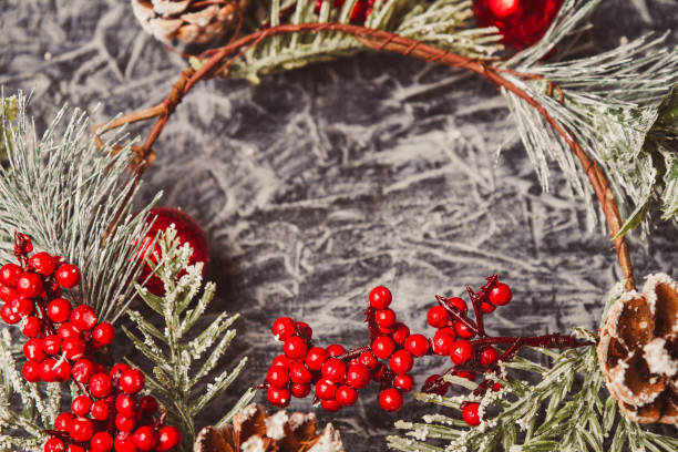 istock christmas wreath on concrete background. Christmas decor self made. 1183531149