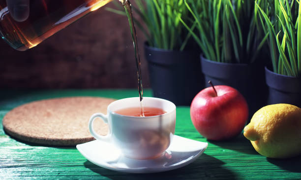 istock Brewing tea on a wooden table 1183533528