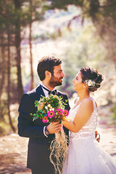 istock The bride and groom posing in nature. 1183534649