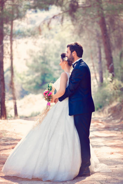 istock The bride and groom posing in nature. 1183534753