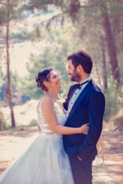 istock The bride and groom posing in nature. 1183535461