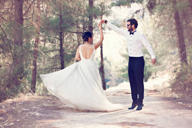 istock The bride and groom posing in nature. 1183535707
