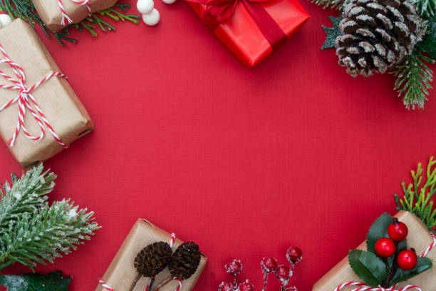 istock Christmas background border, with surprise gift boxes, fir branches and copy space. Winter holidays with presents, top view, flat lay. 1183536097