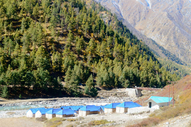 Landscape view of Baspa River Camp area in Chitkul - last village on Indo-Tibetan border. The finest adventure camp in India with Baspa River is on one side and Himalayan mountain on other for experiencing serene beauty of nature. Landscape view of Baspa River Camp area in Chitkul - last village on Indo-Tibetan border. The finest adventure camp in India with Baspa River is on one side and Himalayan mountain on other for experiencing serene beauty of nature. betula utilis stock pictures, royalty-free photos & images