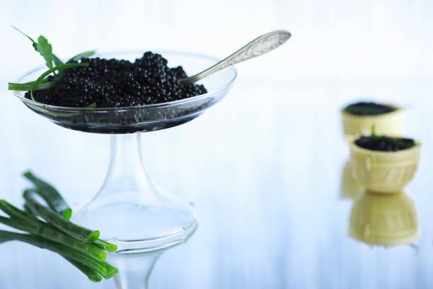 istock Fresh black fish roe. Beluga caviar served with ice. 1183539612