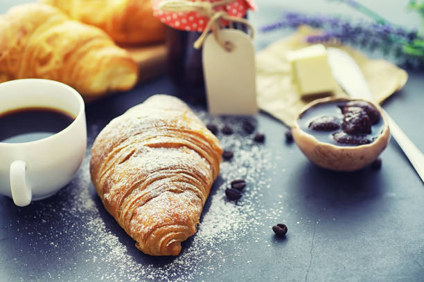 istock Fresh pastries on the table. French flavored croissant. 1183539689