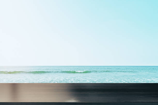 istock Empty wooden counter on beach 1183539694