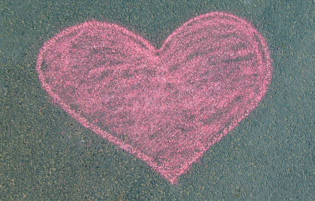istock Children's drawings on the asphalt with chalk. Selective focus. 1183542066